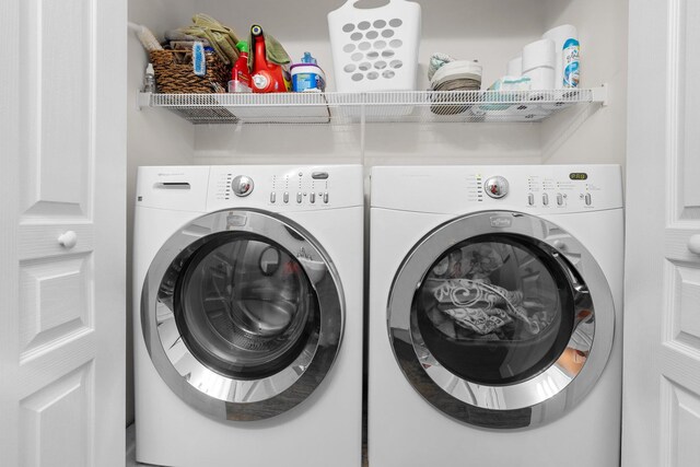 laundry room featuring washing machine and dryer