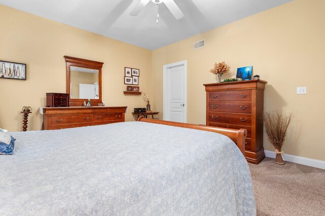 bedroom with ceiling fan and light colored carpet