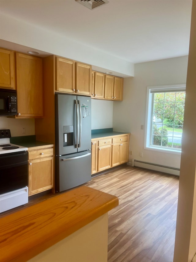 kitchen with white electric stove, light brown cabinets, light hardwood / wood-style flooring, a baseboard radiator, and stainless steel refrigerator with ice dispenser