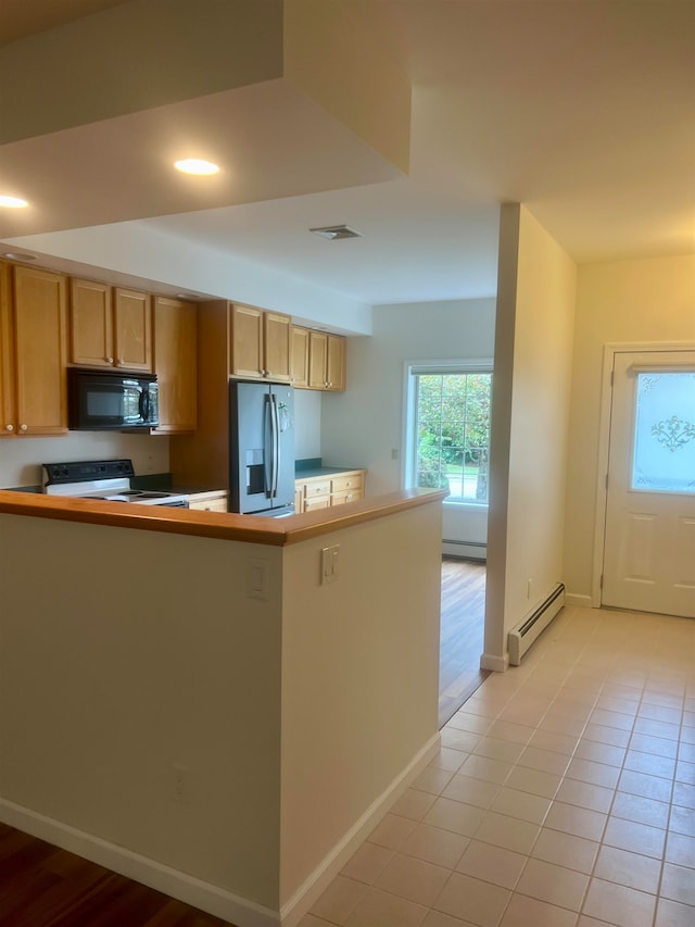 kitchen featuring baseboard heating, stainless steel fridge with ice dispenser, white range with electric cooktop, and light tile patterned floors