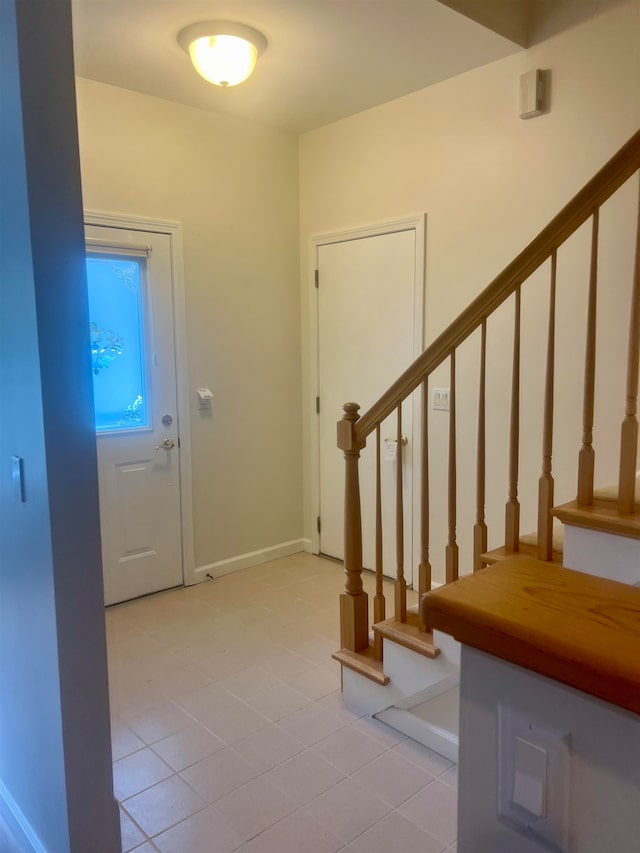 view of tiled foyer entrance