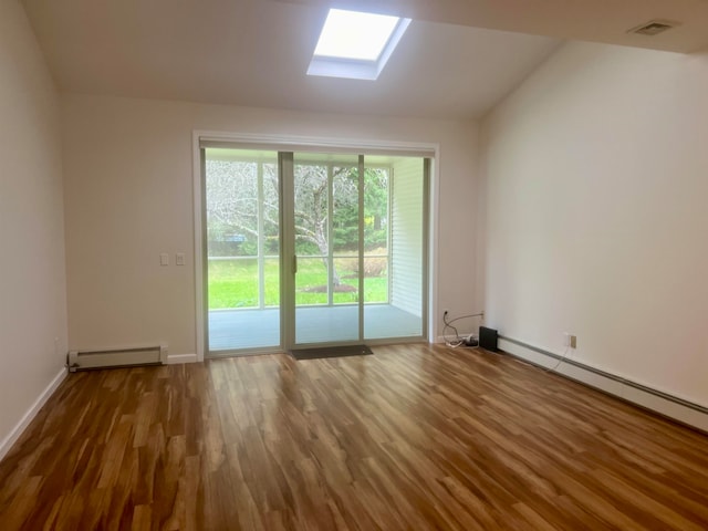 doorway to outside featuring vaulted ceiling with skylight, baseboard heating, and dark hardwood / wood-style flooring