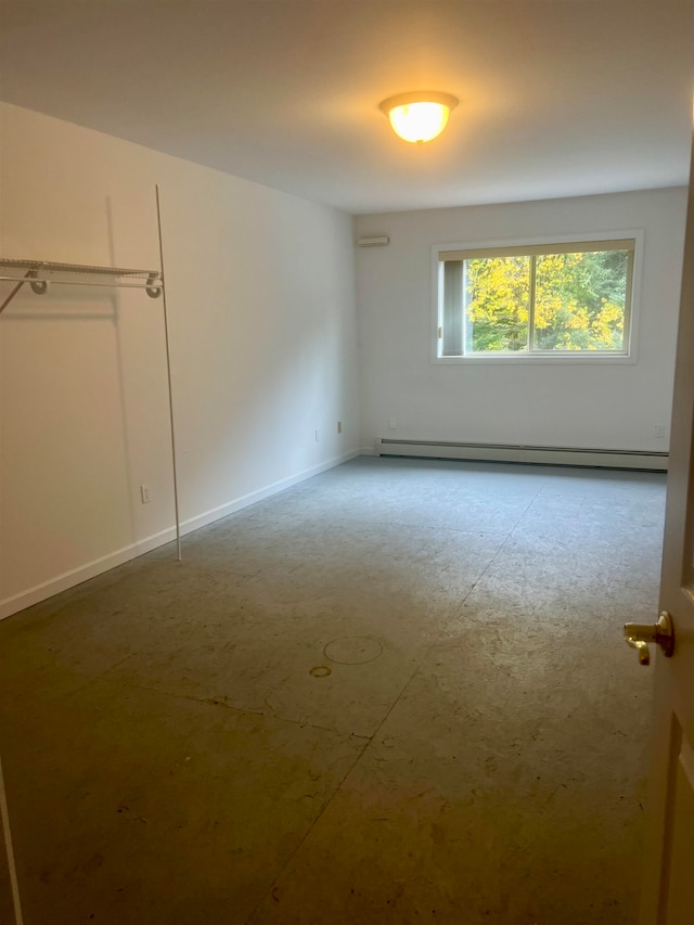 empty room with a baseboard heating unit