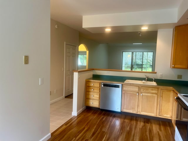 kitchen with dark hardwood / wood-style floors, sink, kitchen peninsula, white range with electric cooktop, and dishwasher