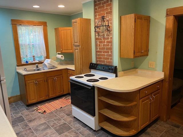 kitchen with white electric range, sink, and kitchen peninsula