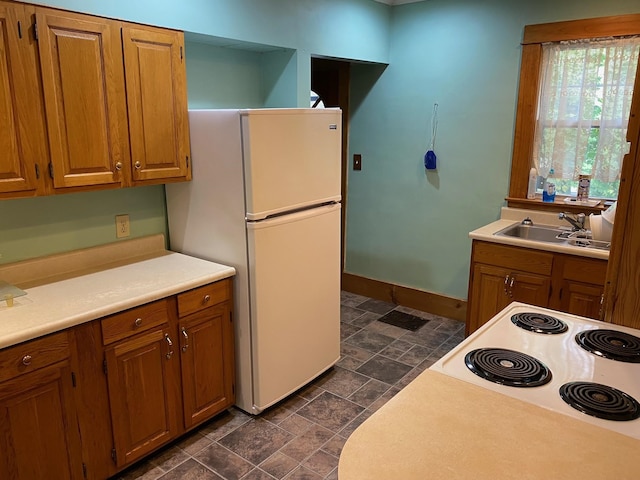 kitchen with white appliances and sink