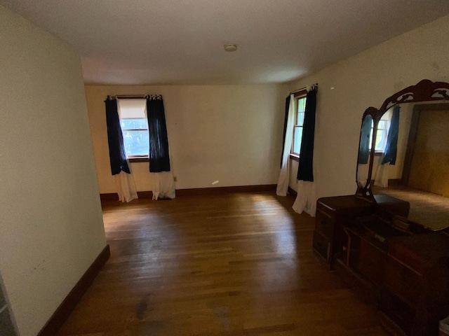 unfurnished room featuring dark hardwood / wood-style flooring