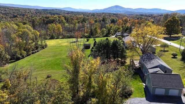 aerial view featuring a mountain view and a forest view