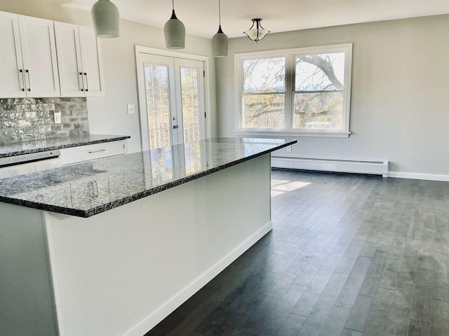 kitchen featuring dark wood-type flooring, white cabinetry, baseboards, french doors, and a baseboard radiator