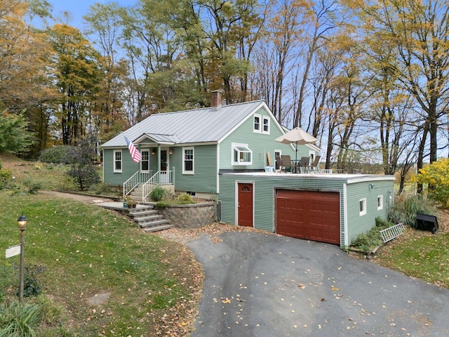 view of front of house with a front yard and a garage