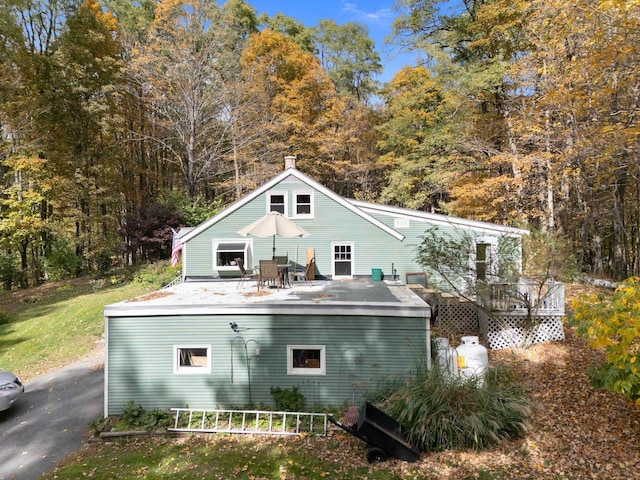 back of property featuring a deck