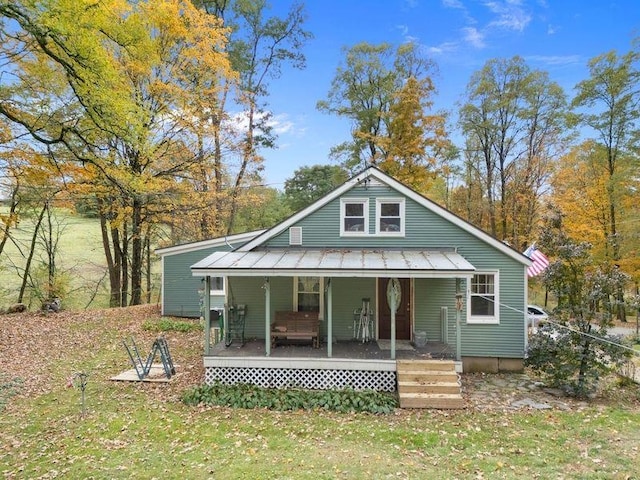 view of front facade with a porch and a front yard