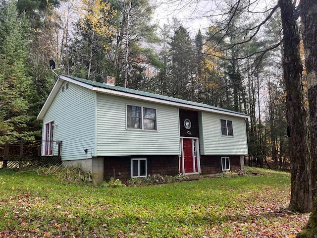 1232 Goss Hollow Rd, Saint Johnsbury, VT 05851 - bi-level home with a chimney and a front lawn