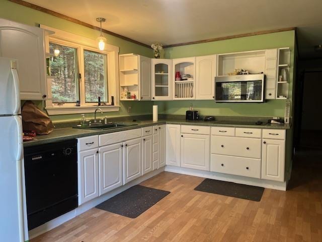 1232 Goss Hollow Rd, Saint Johnsbury, VT 05851 - kitchen featuring open shelves, freestanding refrigerator, stainless steel microwave, a sink, and dishwasher