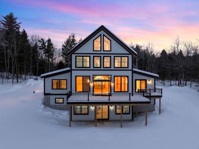 back of house featuring a forest view