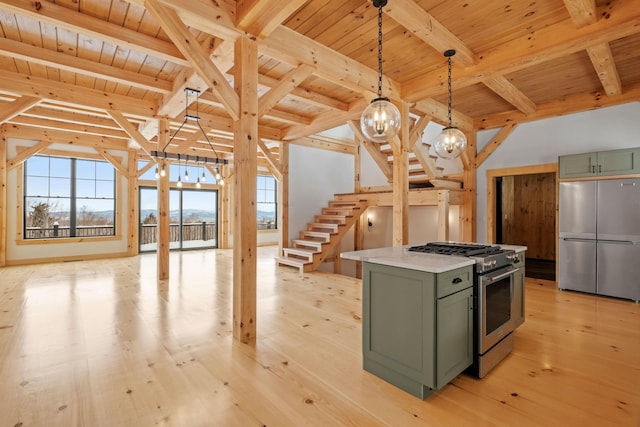 birds eye view of property featuring a water and mountain view and a wooded view