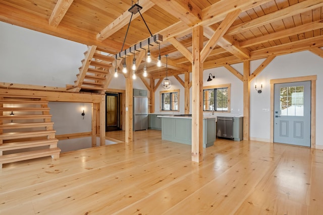 spare room featuring vaulted ceiling with beams and wood ceiling