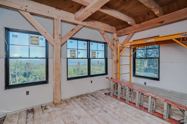 interior space featuring beamed ceiling and wood ceiling