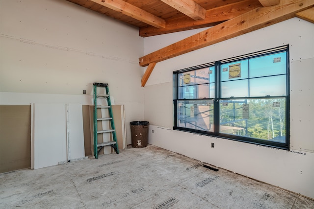 empty room featuring beam ceiling