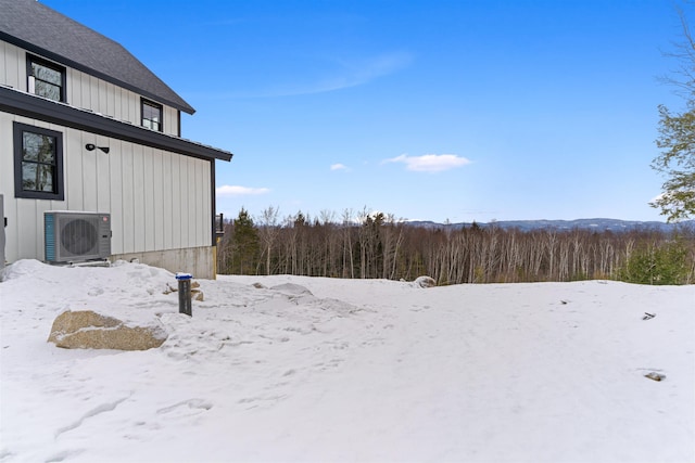 snowy yard with ac unit