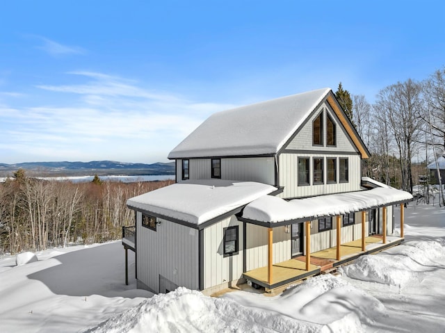 rear view of house featuring a porch