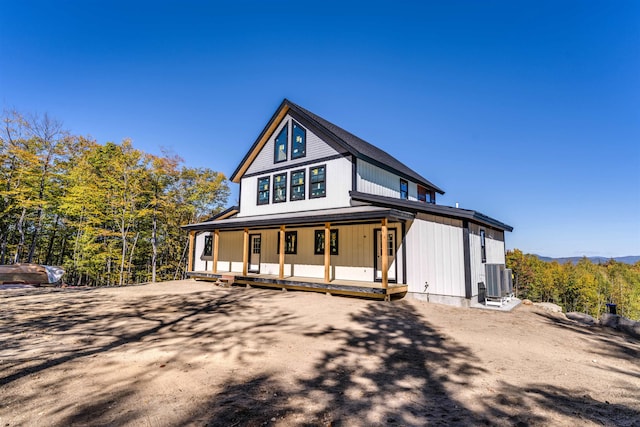 view of front of house featuring central AC and a porch