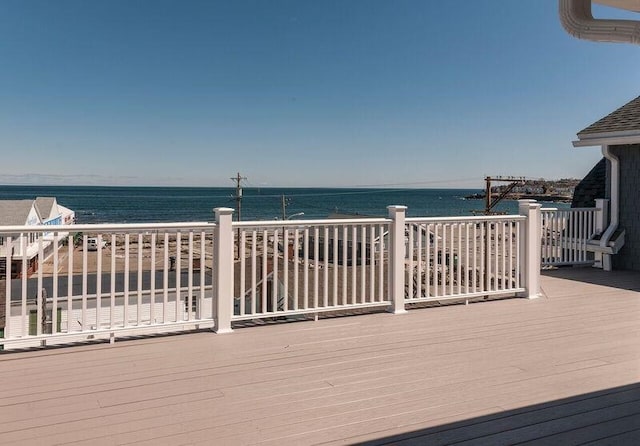 wooden deck with a water view