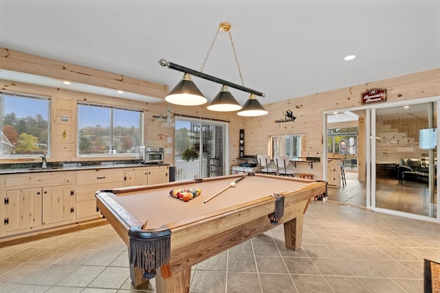 playroom with sink, wood walls, and pool table