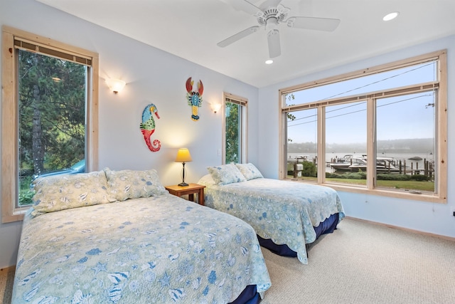 carpeted bedroom with ceiling fan