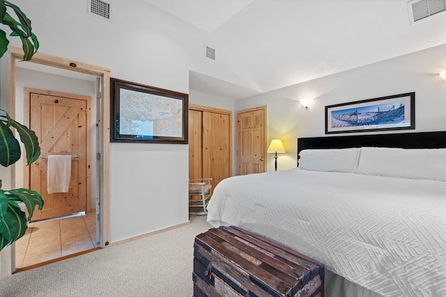 bedroom featuring carpet and lofted ceiling