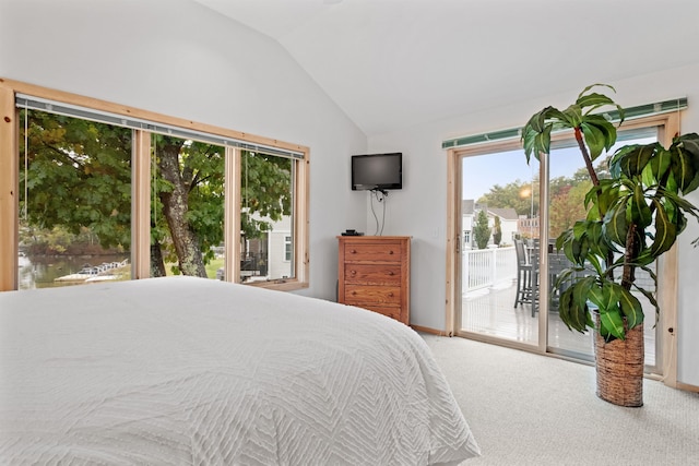 bedroom featuring carpet, access to outside, and lofted ceiling