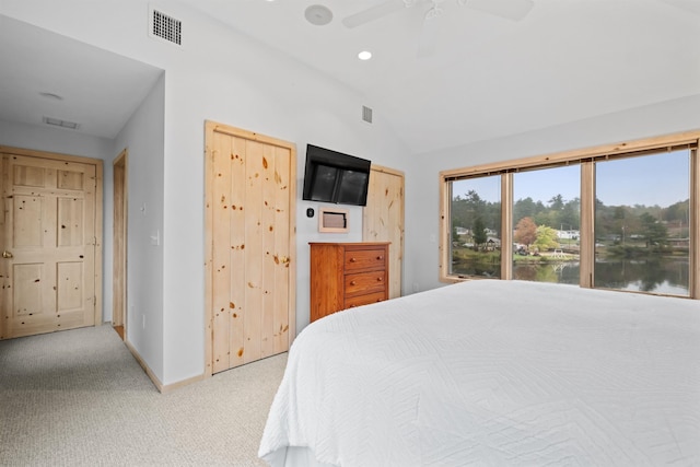 carpeted bedroom featuring ceiling fan and lofted ceiling