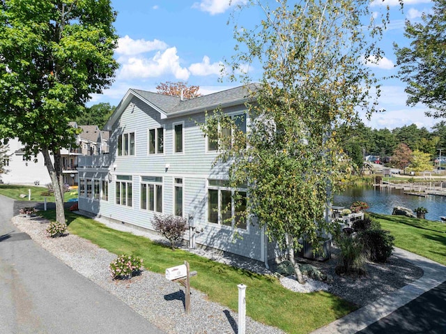 view of front of house featuring a water view and a front yard