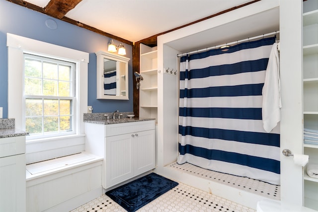 bathroom with tile patterned floors, vanity, and a shower with shower curtain