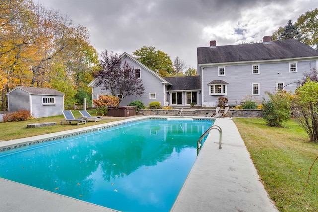 view of pool with a yard