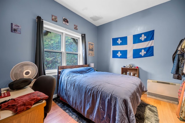 bedroom with light hardwood / wood-style floors