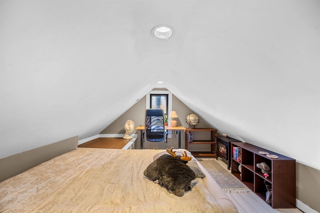 bedroom with lofted ceiling