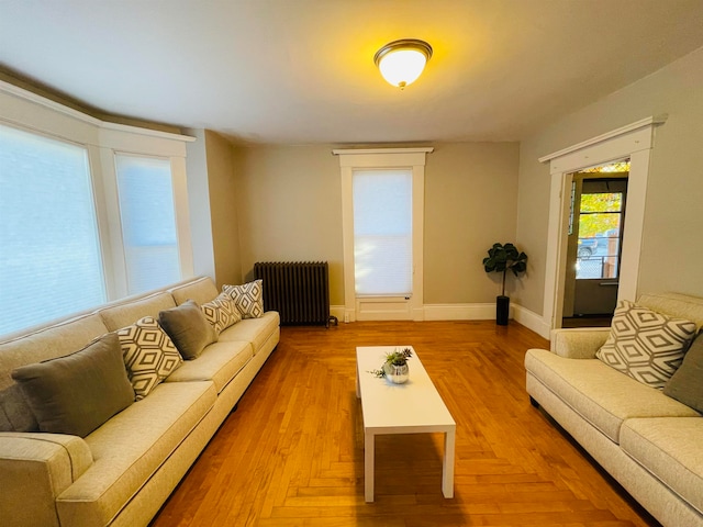 living room with parquet flooring and radiator