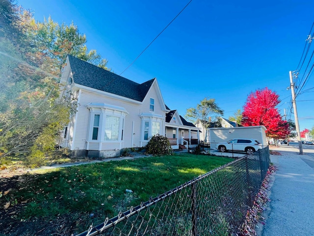 view of property exterior featuring a lawn