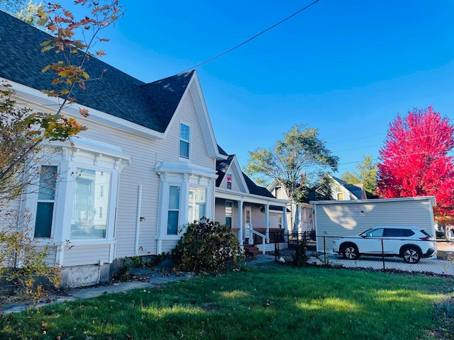 view of side of property featuring a yard