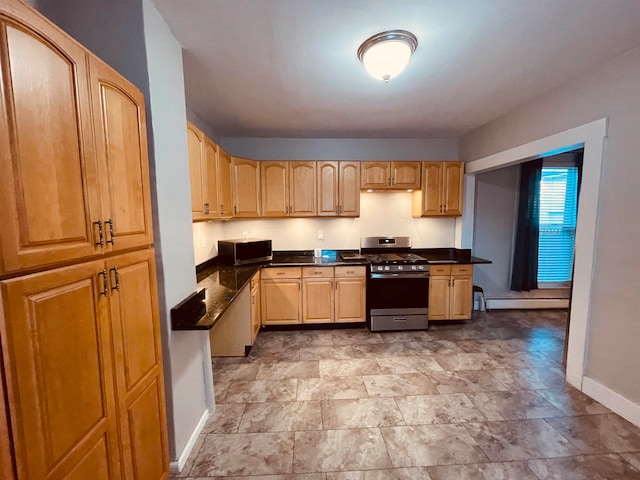 kitchen featuring a baseboard heating unit, stainless steel appliances, and light brown cabinetry