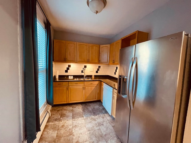 kitchen with a baseboard heating unit, backsplash, stainless steel fridge with ice dispenser, white dishwasher, and sink