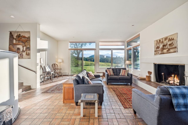 living room featuring expansive windows and a mountain view