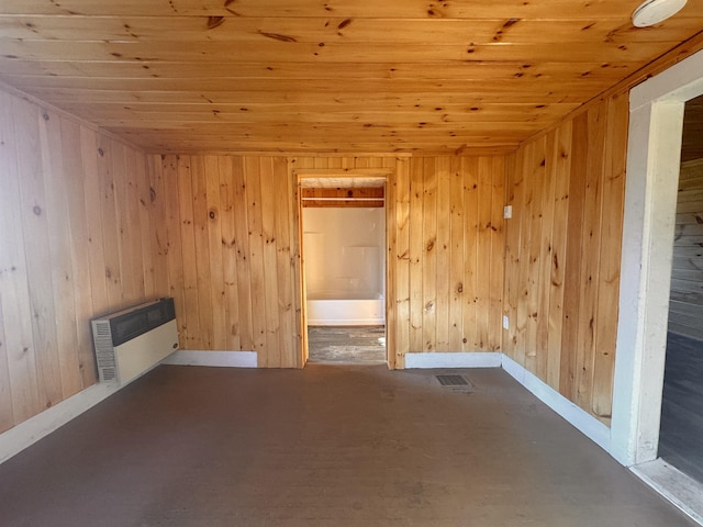 10 N Ave, Richford, VT 05476 - spare room with wooden ceiling, wooden walls, and radiator