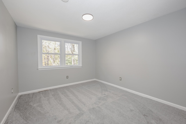 unfurnished room with carpet floors