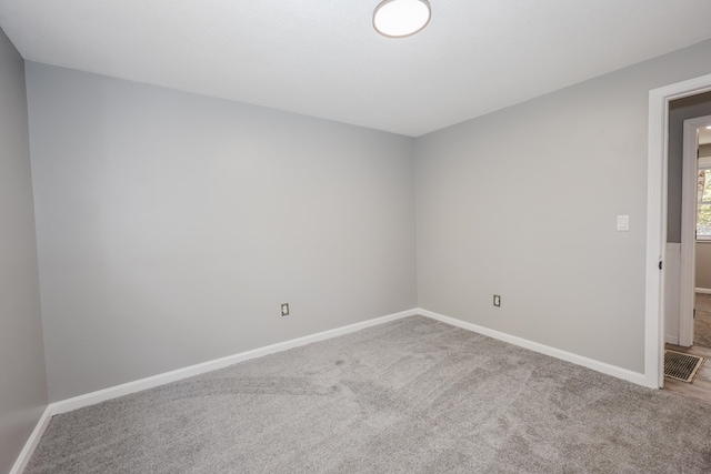 spare room with carpet floors