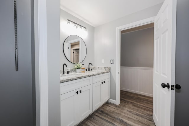 bathroom featuring vanity and hardwood / wood-style floors