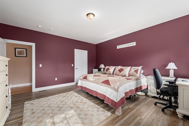 bedroom featuring dark hardwood / wood-style flooring