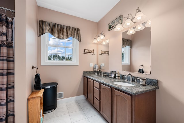 bathroom with vanity and tile patterned flooring