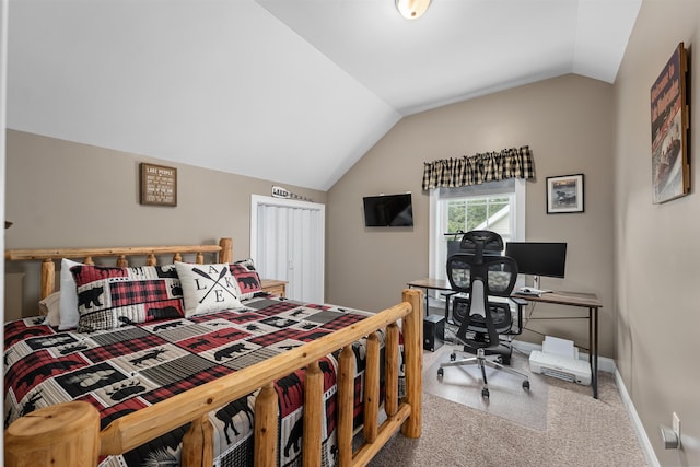 carpeted bedroom with vaulted ceiling